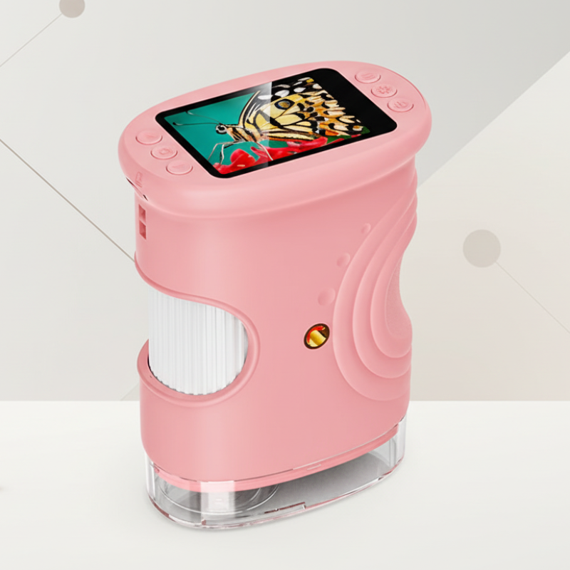 Pink digital microscope showing its side grip, focus wheel, and built-in display