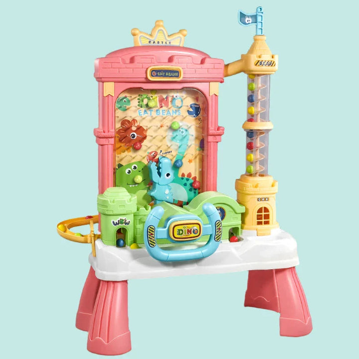 Pink castle-style ball catcher with dinosaur figures, a front steering wheel and matching pink legs.