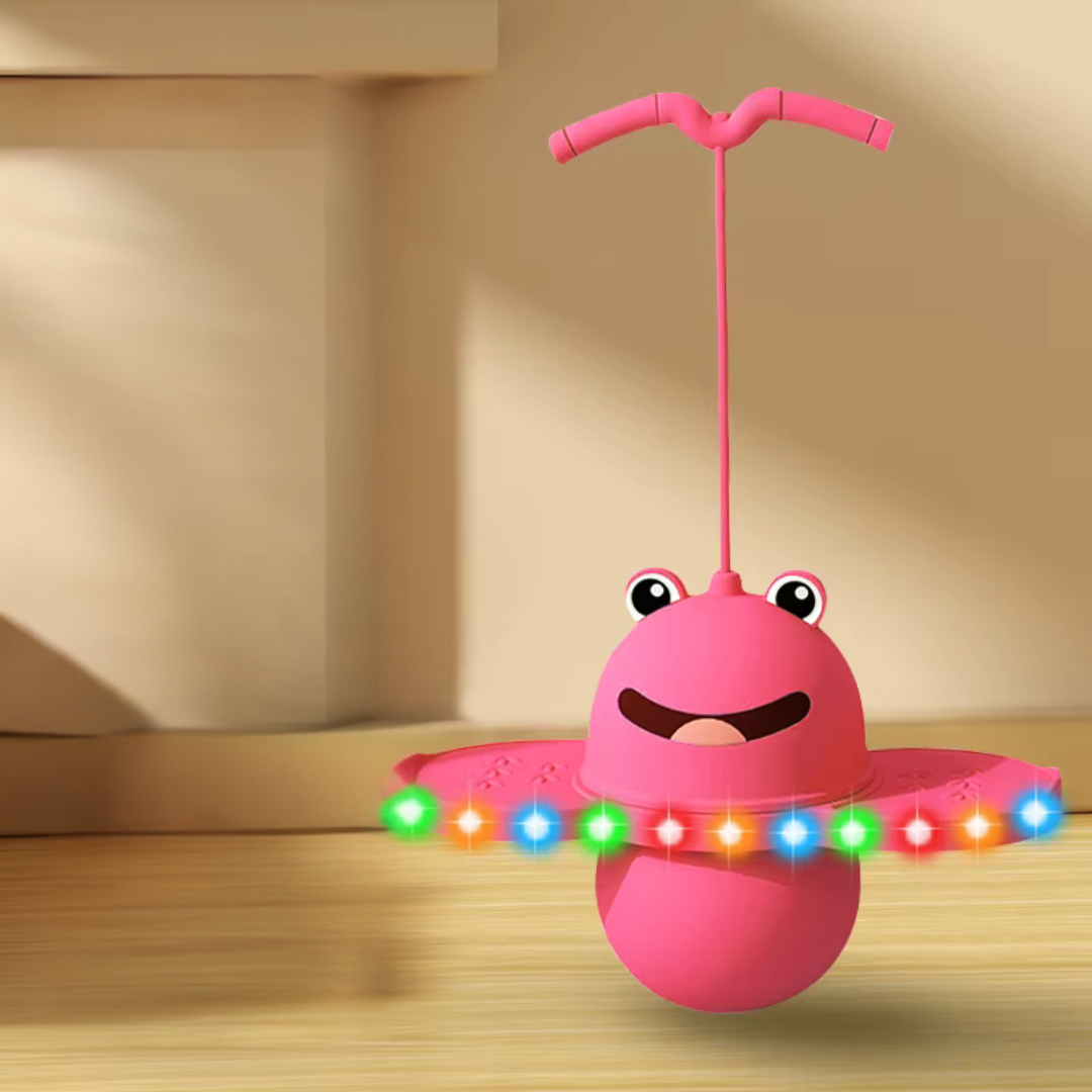 Pink frog pogo stick with multicolored lights along the foot platforms.