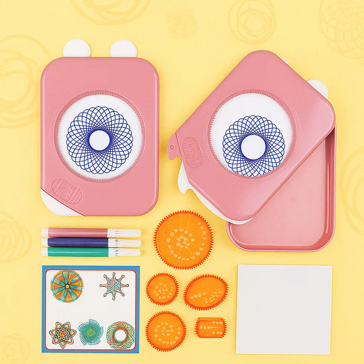Pink drawing kit with a storage case, five orange gears, felt-tip pens, paper, and an illustrated guide