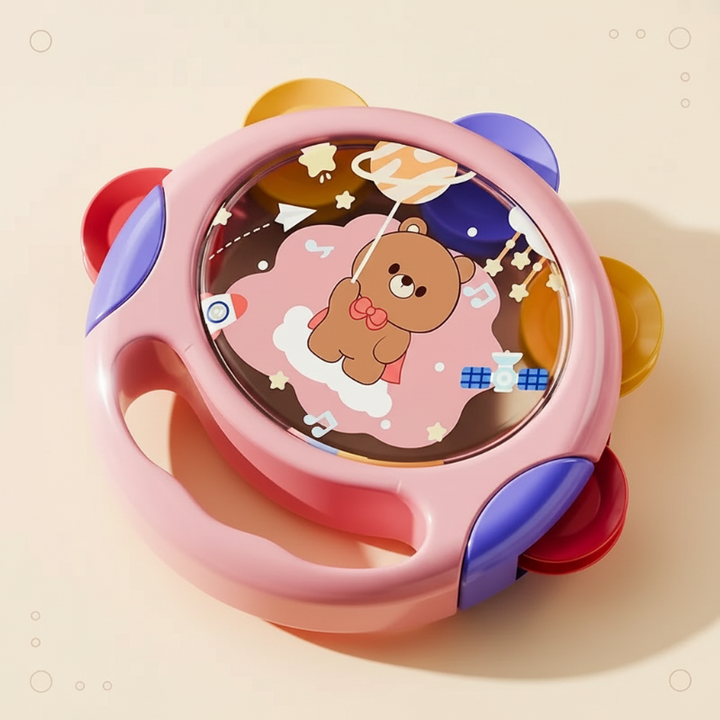 Pink hand tambourine with a bear illustration and red, purple, and yellow accents
