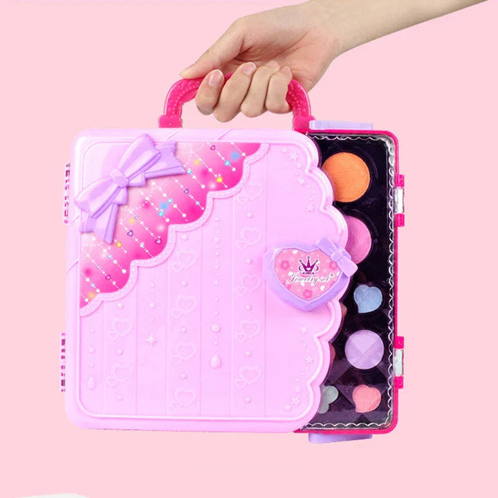 Hand holding the pink makeup drawing case by its top handle
