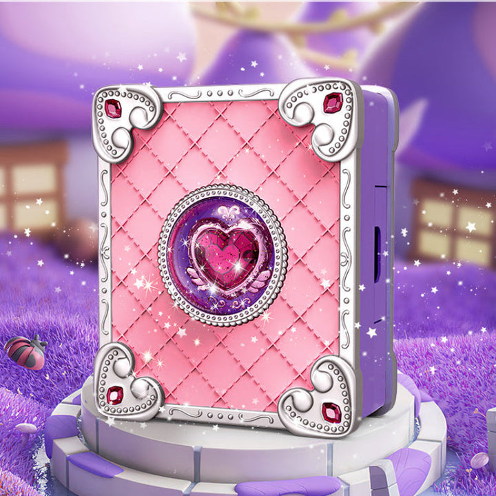Pink book-shaped craft station with a purple base and decorative heart centerpiece.