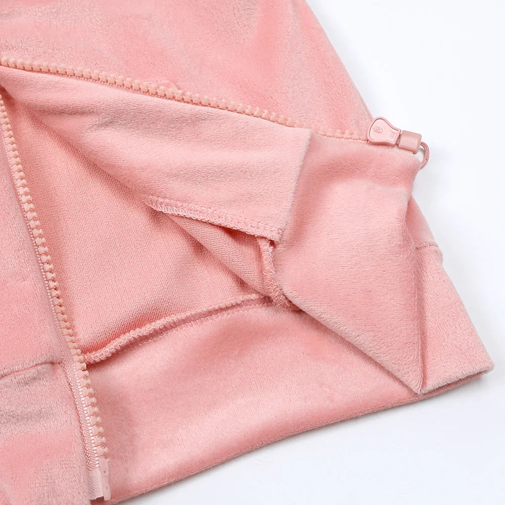 Inside of the pink hoodie showing the zipper, stitching, and hem