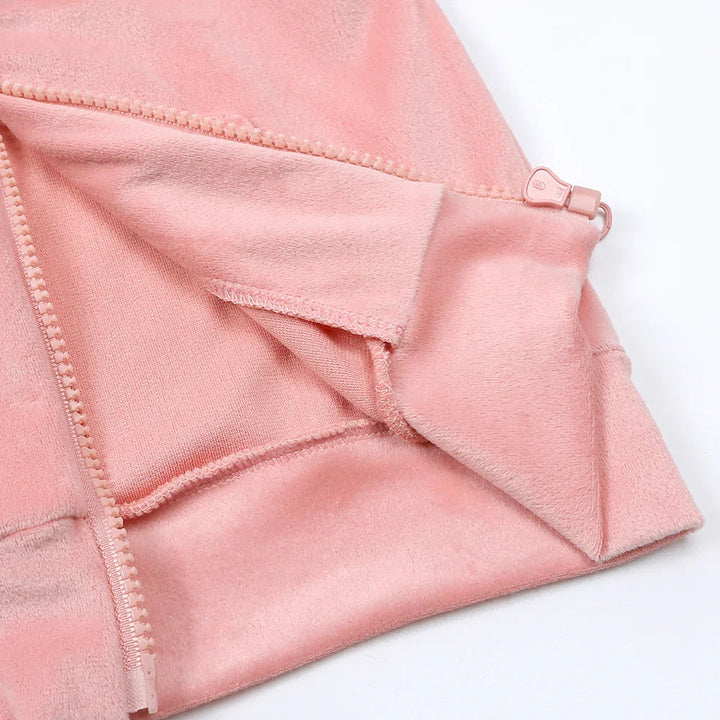 Inside of the pink hoodie showing the zipper, stitching, and hem