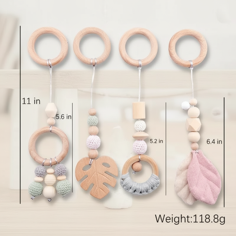 Four Pink Leaf hanging toys with wooden rings, beads, leaf shapes, and length measurements.
