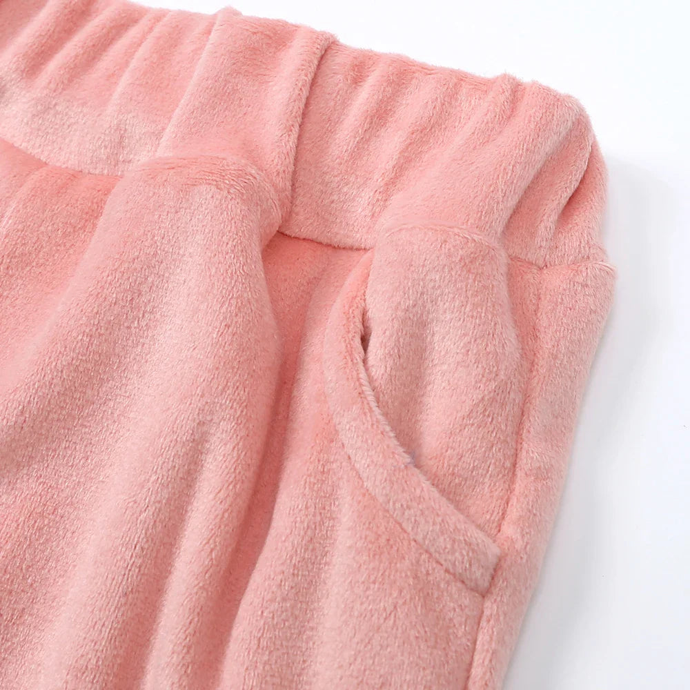 Pink pants turned back at the waist to show the inner waistband and pocket stitching
