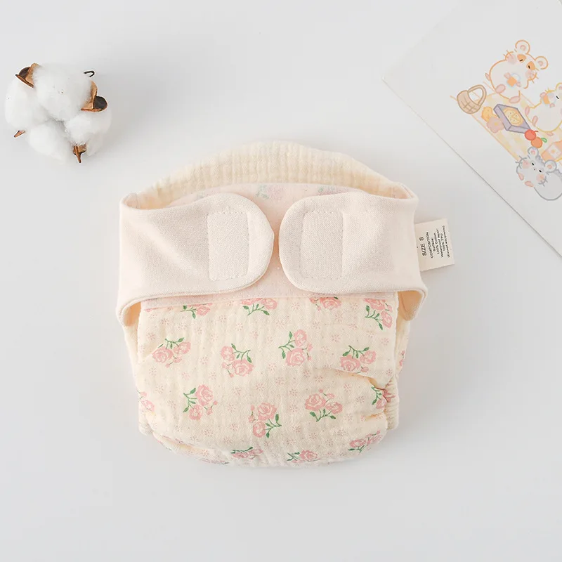 Cloth diaper with small pink rose prints and green leaves