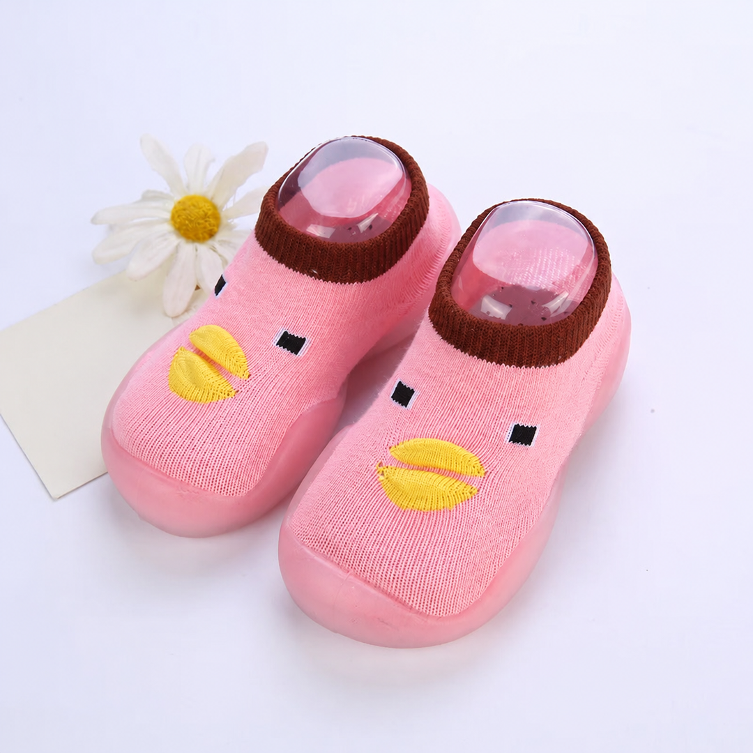 Pink sock shoes with yellow duck beaks and dark contrasting cuffs