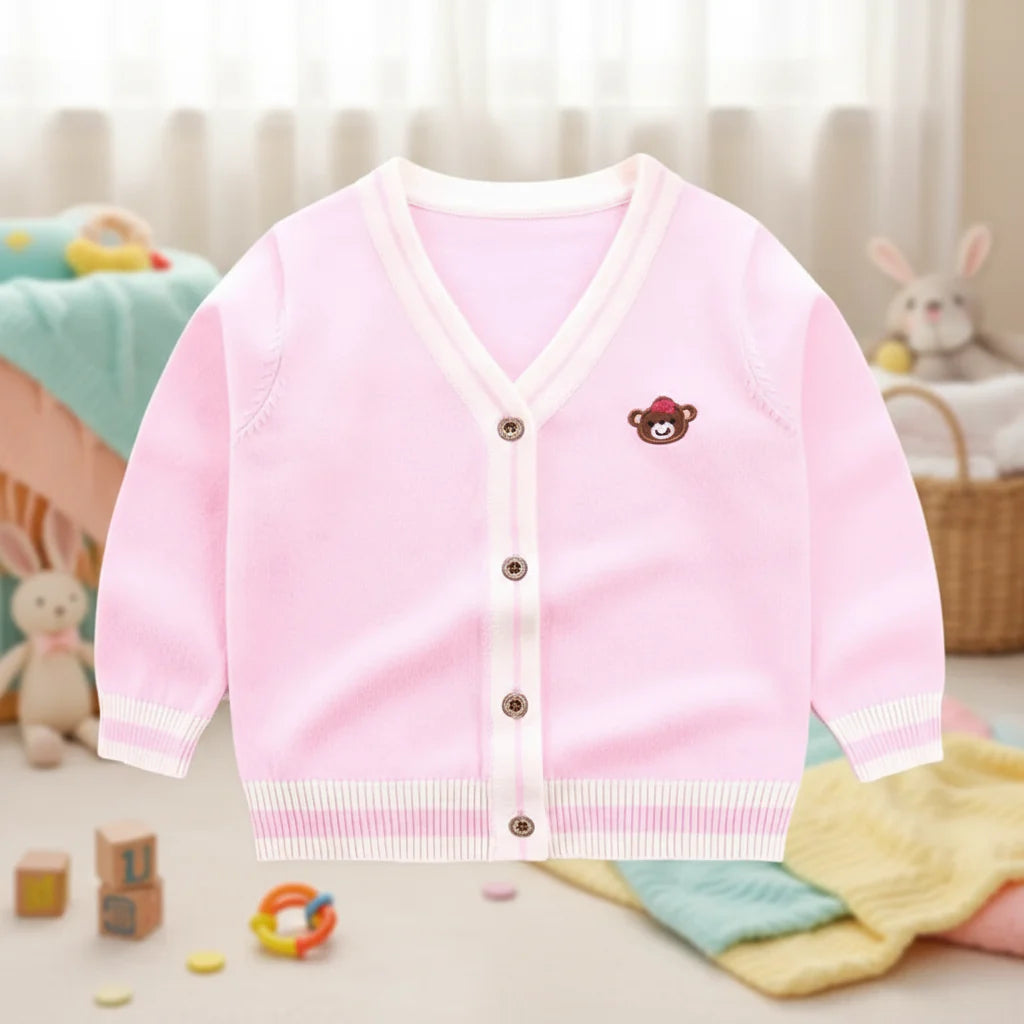 Pink teddy bear knit cardigan with cream striped trim and a V-neck