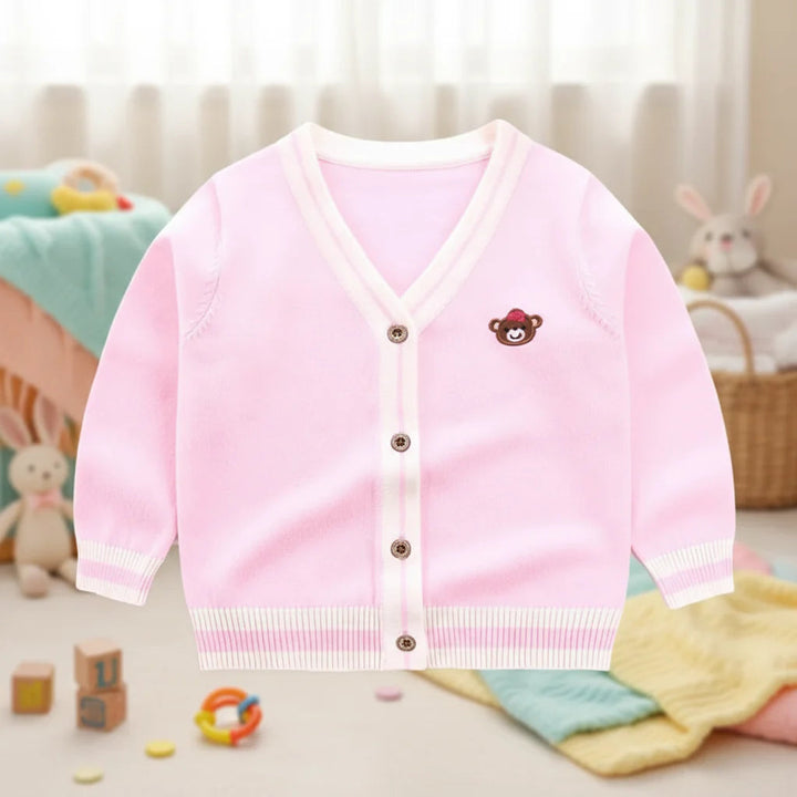 Pink teddy bear knit cardigan with cream striped trim and a V-neck