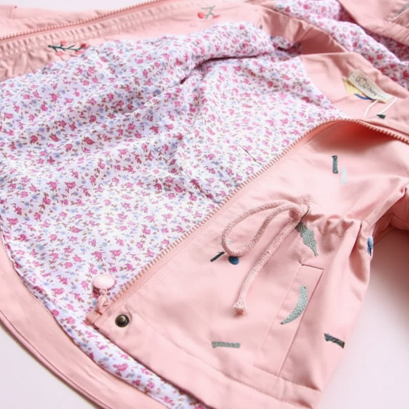 Pink windbreaker opened to show the small floral pattern on its cotton lining