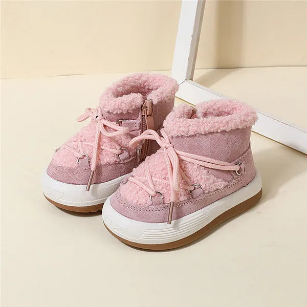 Pink winter boot color option with matching laces, side zipper, and faux fur collars