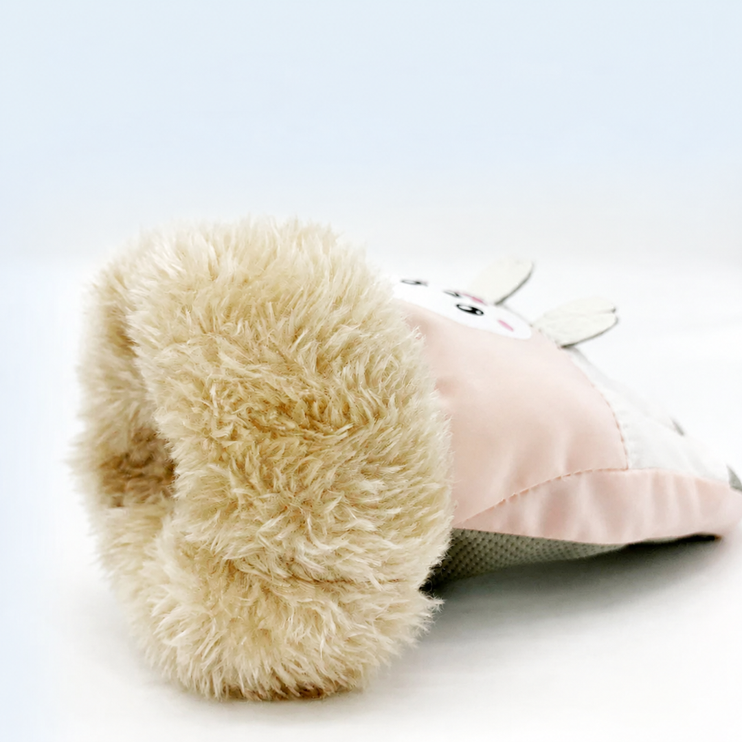 Close-up of a pink winter glove with thick plush lining visible inside the cuff.