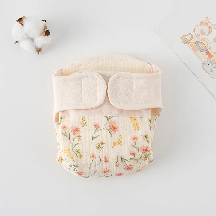 Cloth diaper with delicate pink and yellow flowers and green stems