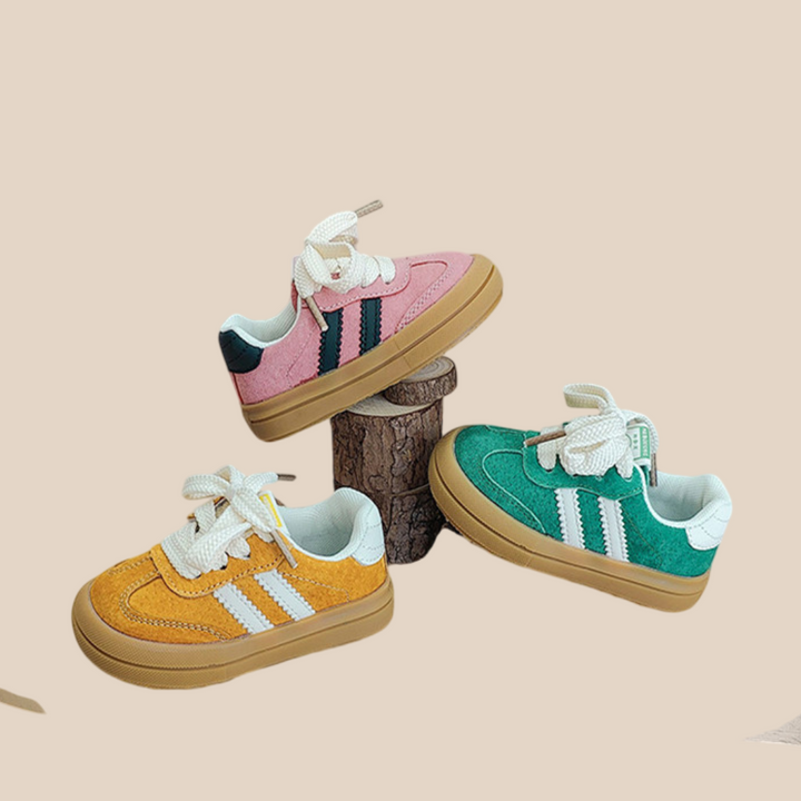 Pink, yellow and green lace-up sneakers with contrast side stripes and gum-colored soles
