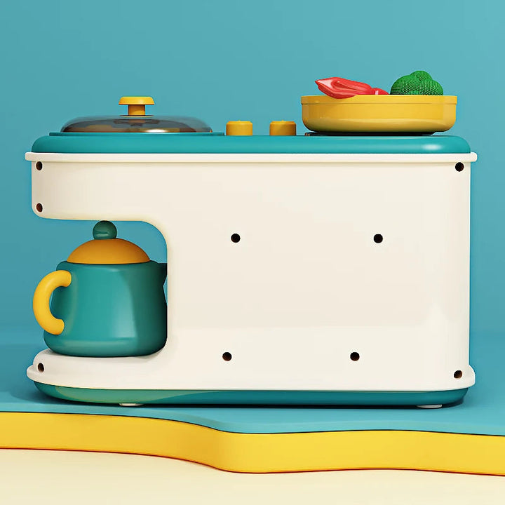 Rear view of the cream-and-teal play kitchen with a yellow pan and a kettle