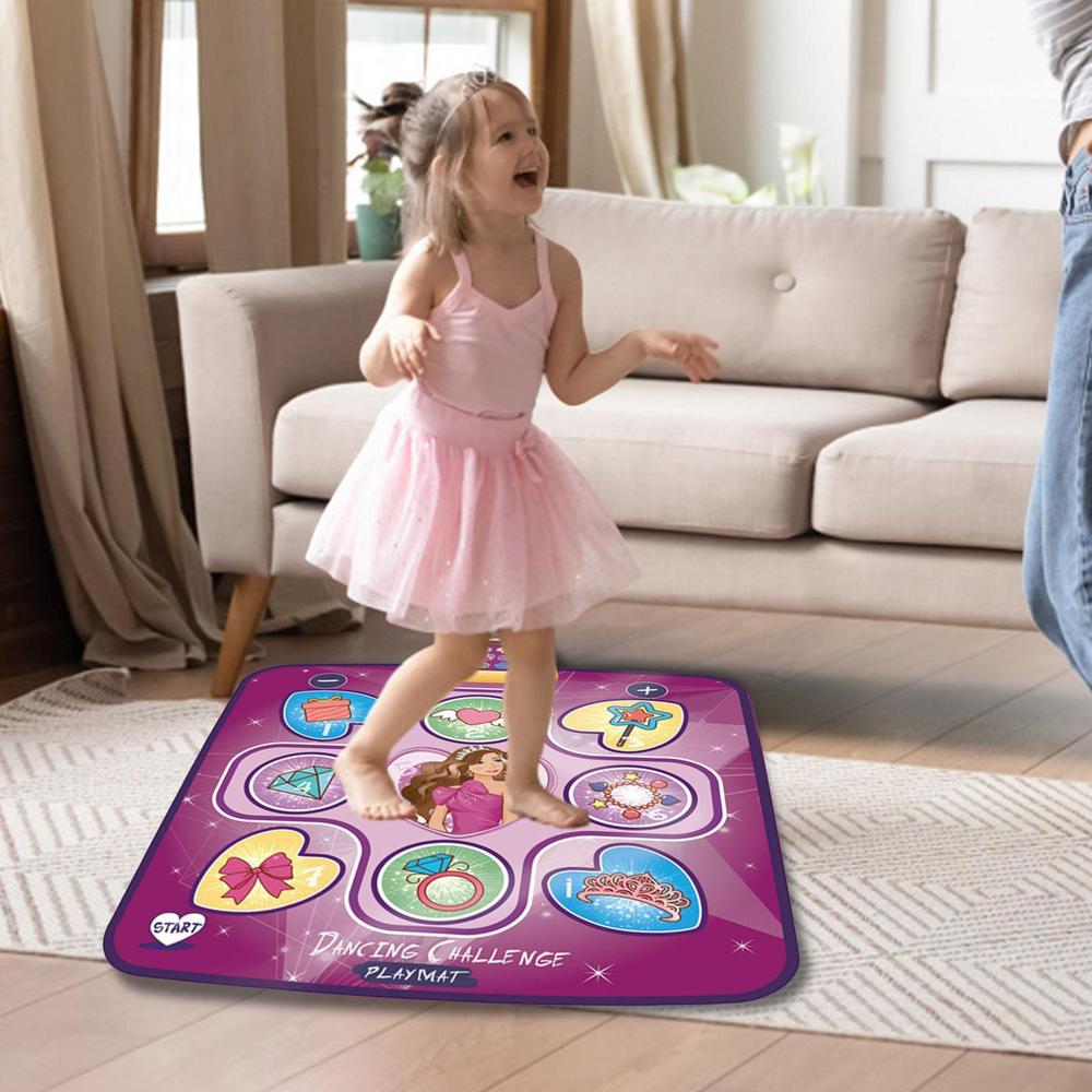Child in a pink dress dancing on the purple Princess mat in a living room