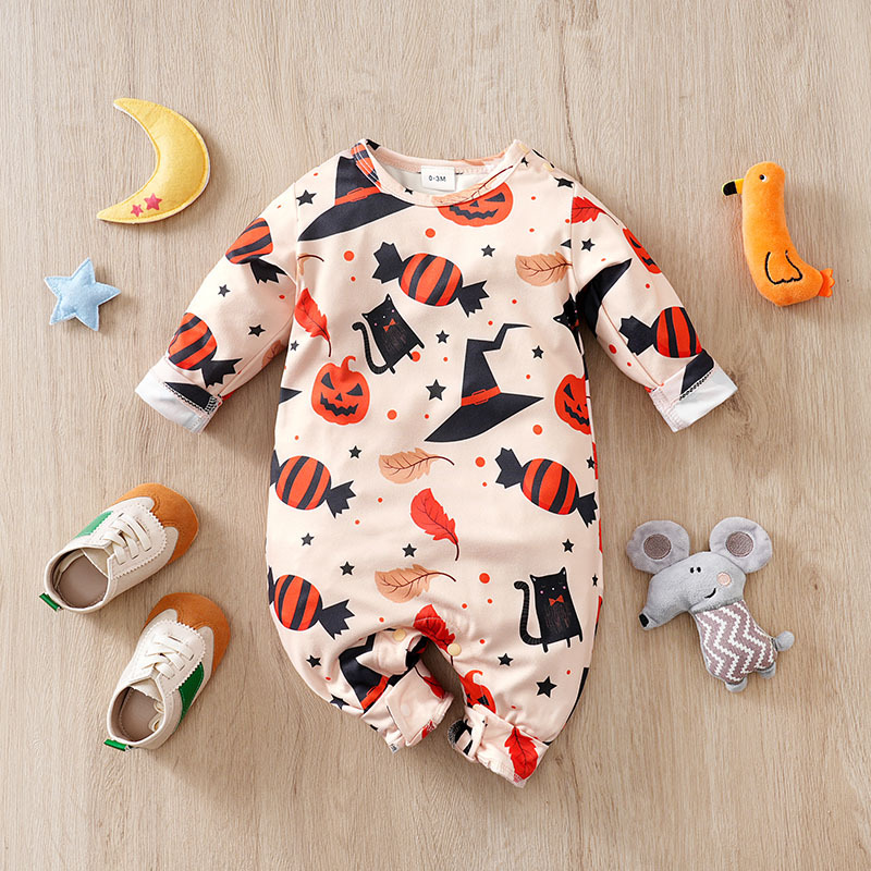 White baby Halloween romper with pumpkin, witch hat, star, and candy prints