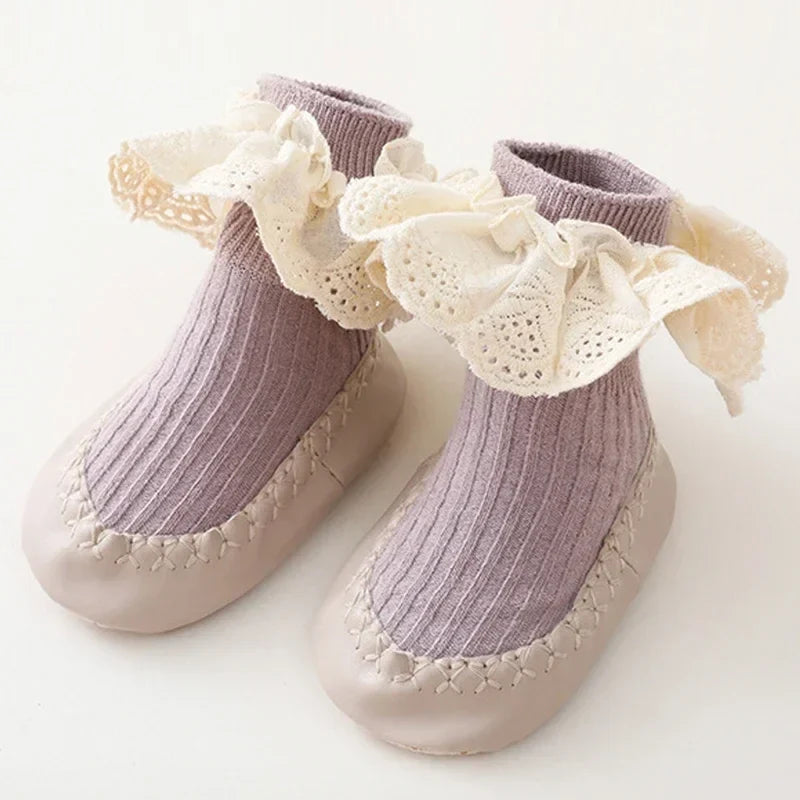 Purple baby sock shoes with cream lace cuffs and beige soles