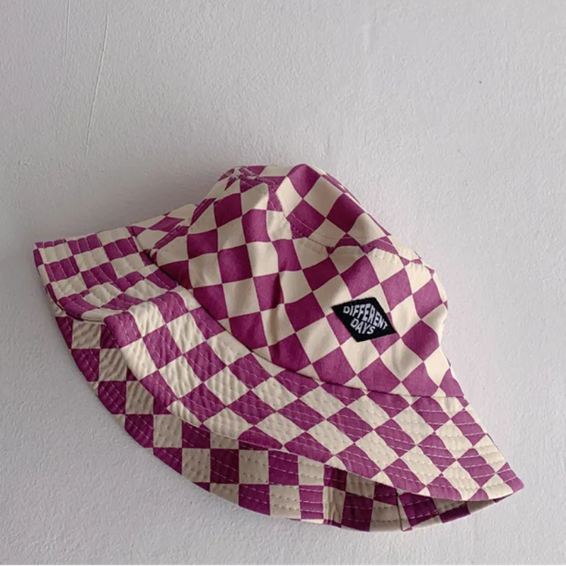 Purple-and-cream checkered bucket hat with a stitched front patch