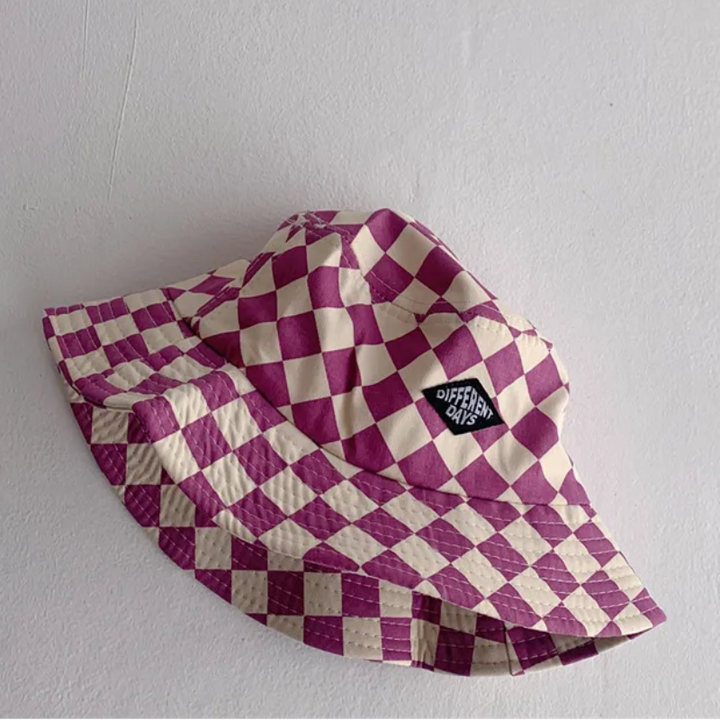 Purple-and-cream checkered bucket hat with a stitched front patch