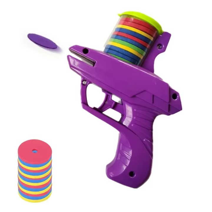 Purple toy disc blaster with colorful discs in its top cartridge and a separate stack of discs.