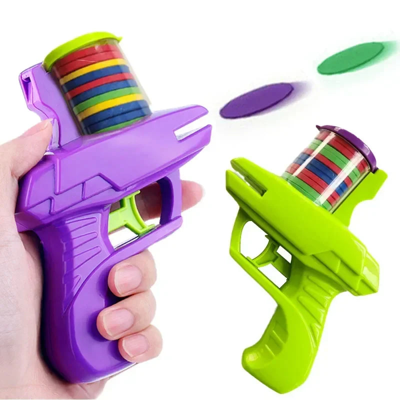 Purple and green foam disc toy blasters with loaded top cartridges and colorful discs.