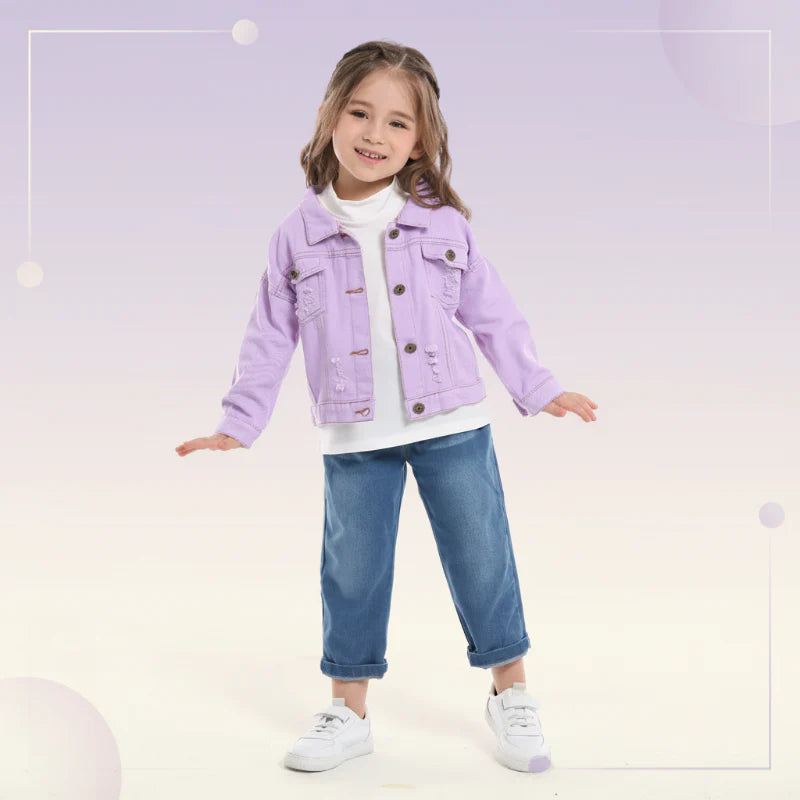 Child wearing a purple denim jacket over a white top with jeans and sneakers