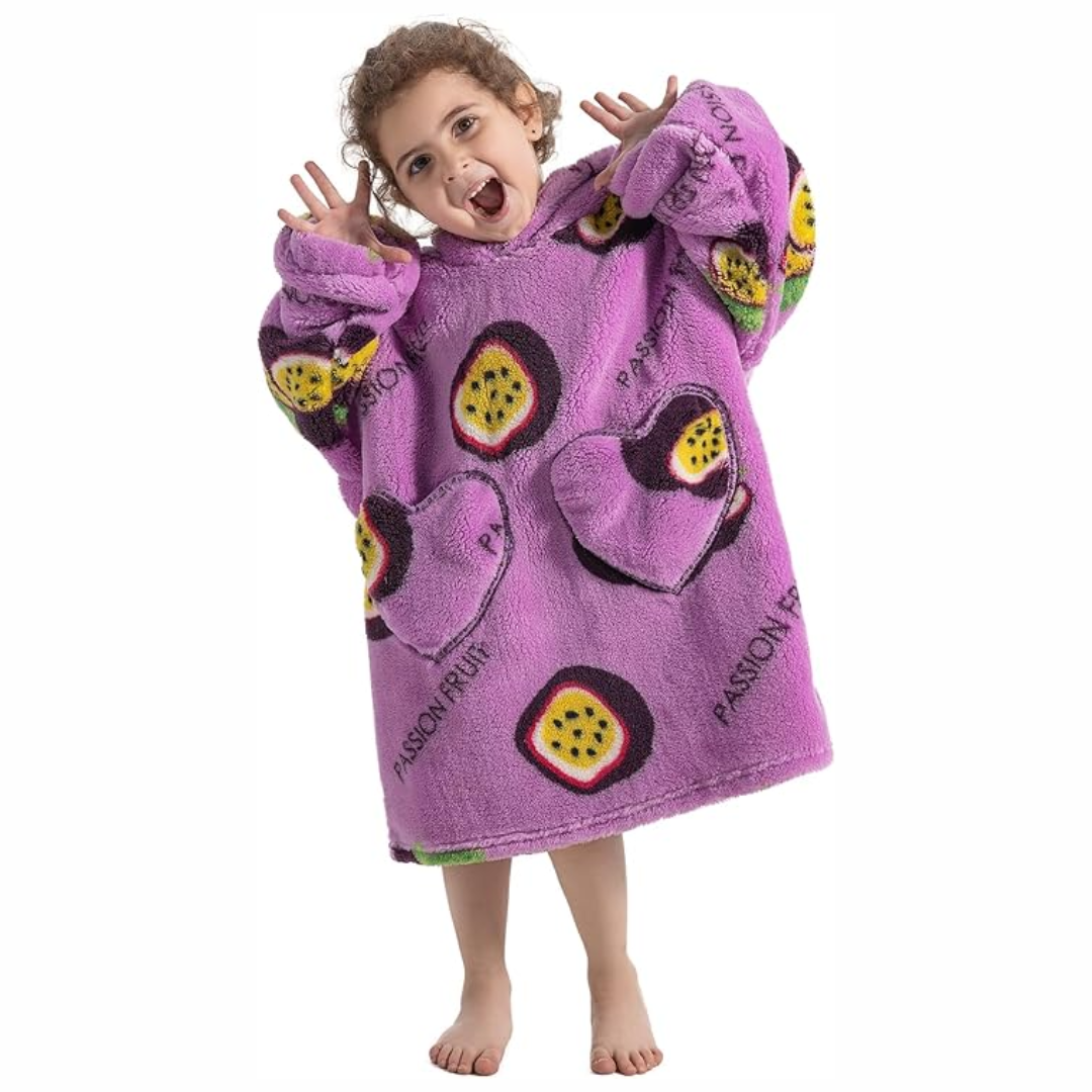 Child wearing a purple passion fruit-print hooded blanket