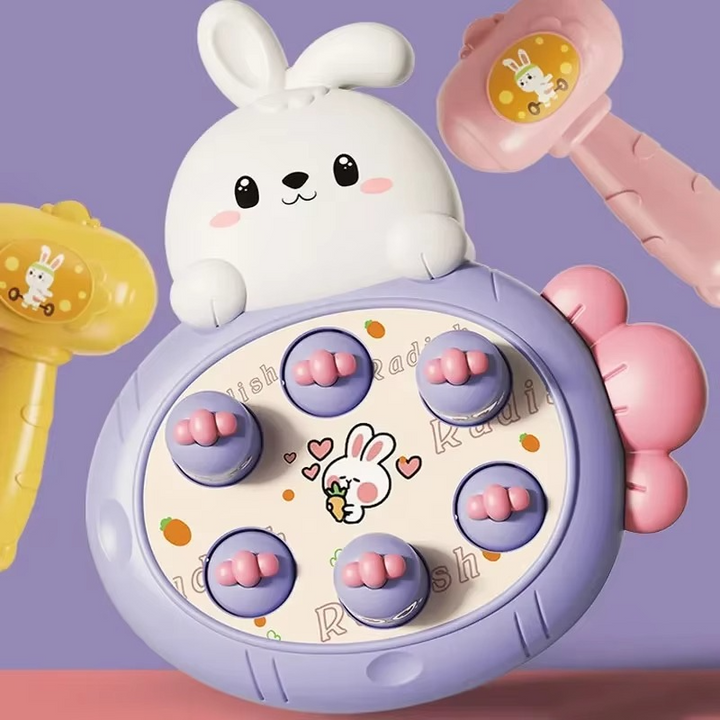Purple rabbit-themed tapping board with pink-topped targets and colorful hammers