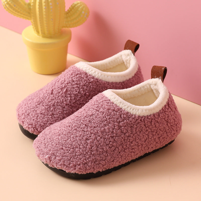 Purple wool slippers with cream-colored lining and brown heel pull tabs