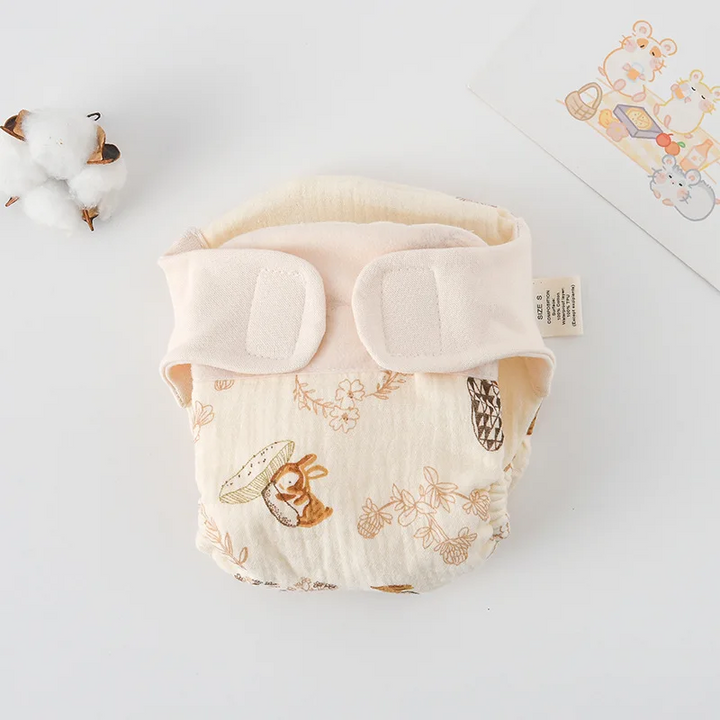 Rabbit-and-mushroom print cloth diaper with a cream adjustable waistband