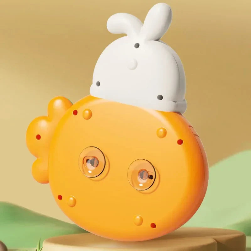 Underside of an orange rabbit-shaped playboard with two clear suction cups