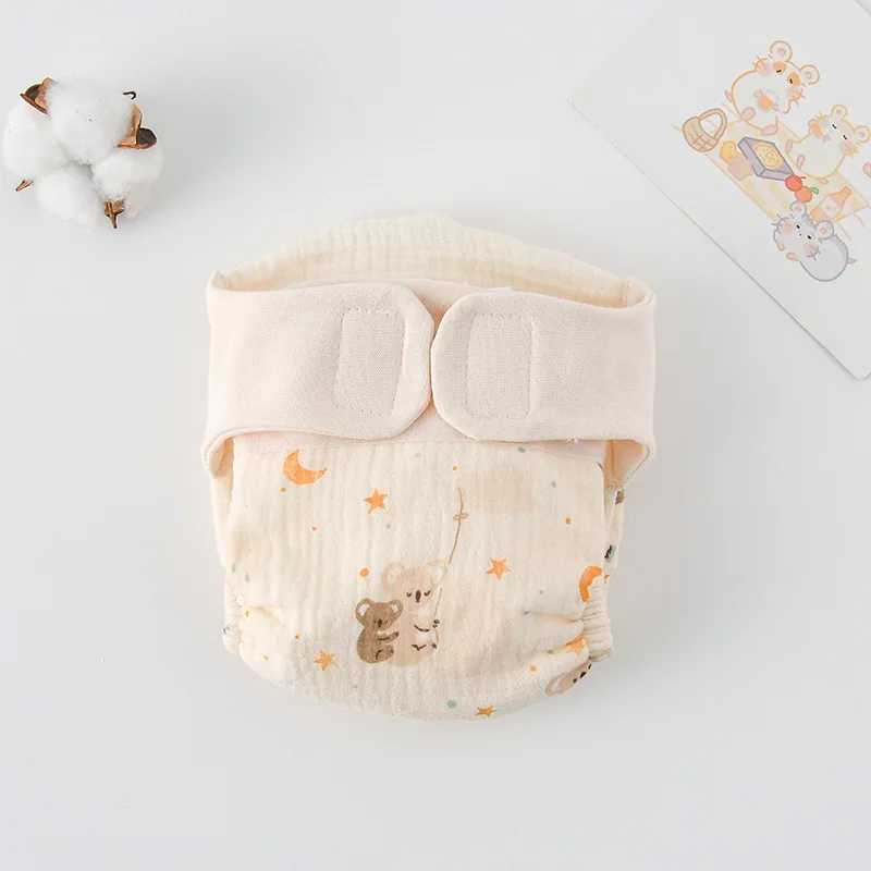 Cloth diaper with a raccoon, stars, and crescent moons