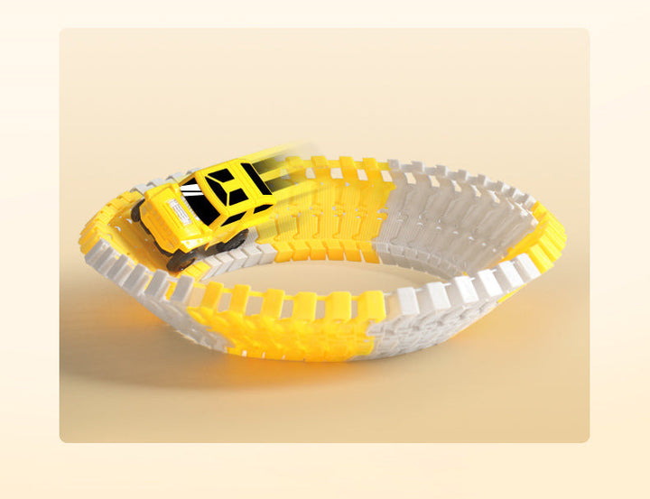 Yellow toy car resting inside a bowl-shaped loop of yellow and gray track