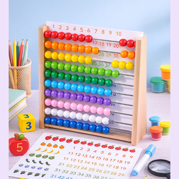 Rainbow-bead wooden abacus with an illustrated counting sheet on a desk