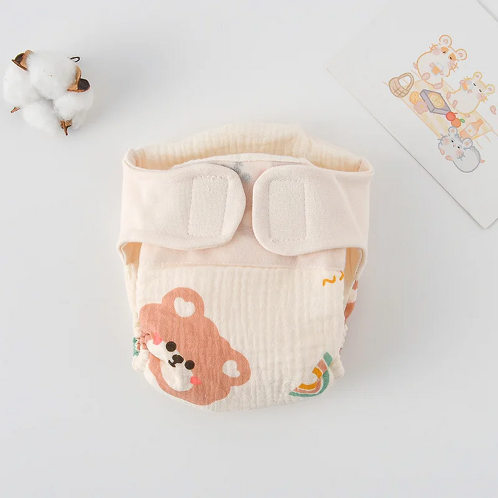Cloth diaper with a large bear face and rainbow print