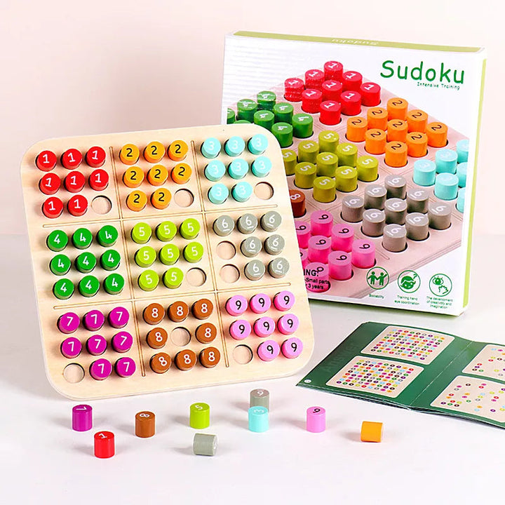 Colorful Sudoku board with numbered pieces, a game booklet, and packaging