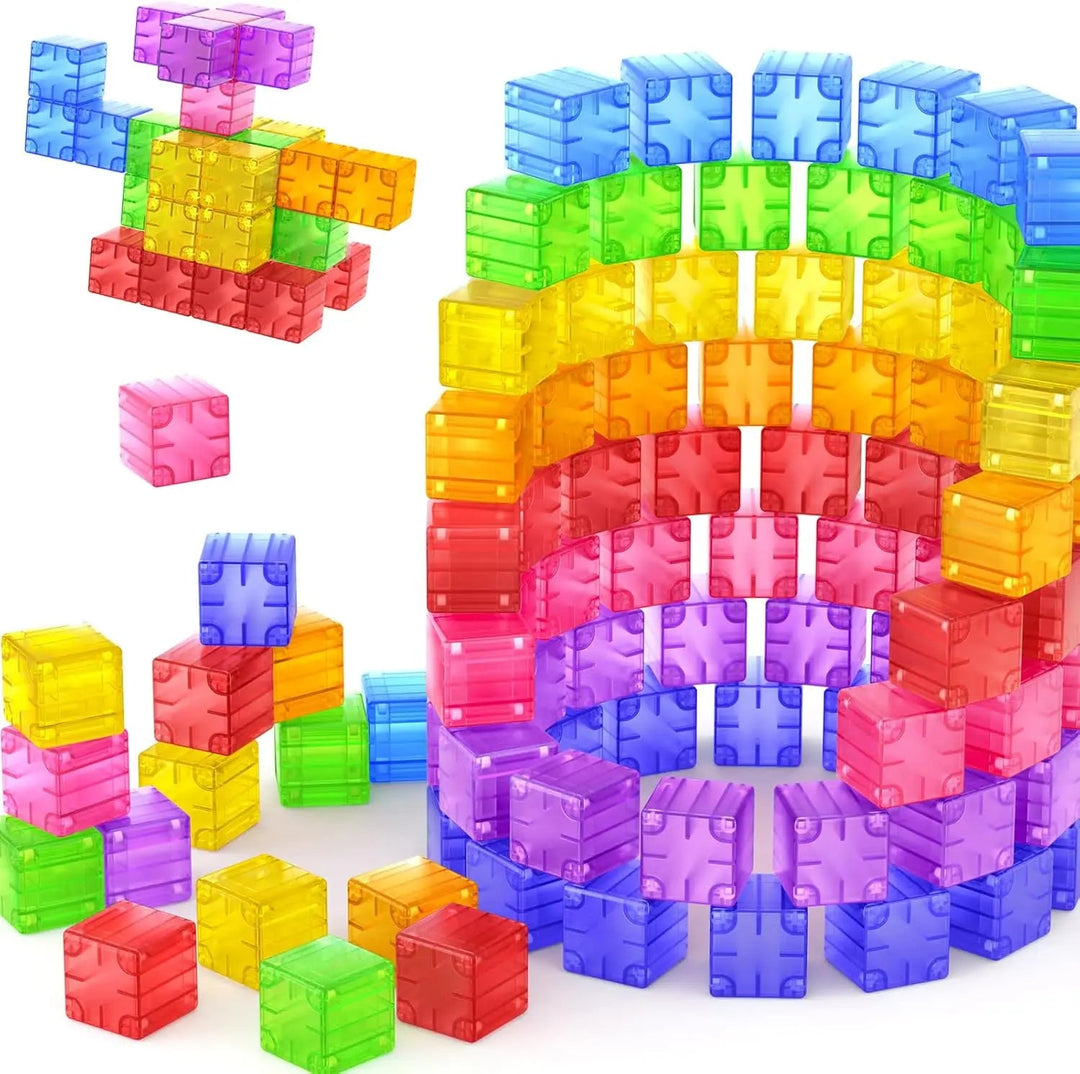 Transparent rainbow magnetic cubes arranged into a tall structure with smaller builds beside it.