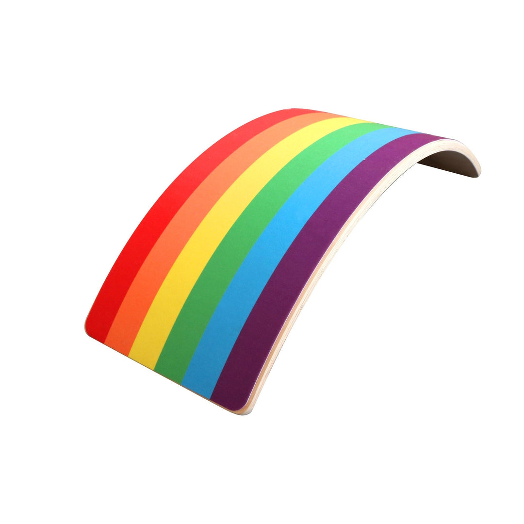 Rainbow-striped wooden balance board positioned as an arch
