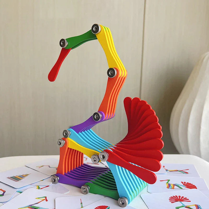Wooden folding puzzle arranged in a tall bird-like shape with a red fan-shaped tail