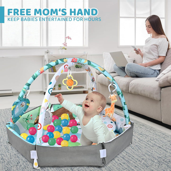 Baby sitting in a raised-side ball pit with hanging toys while an adult sits nearby