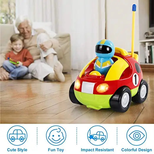 Colorful RC race car on a wood floor with a child and adult in the background.