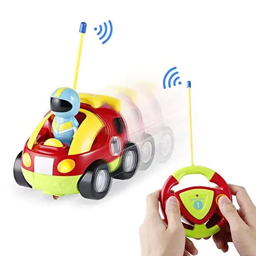 Hands holding the steering-wheel remote beside the colorful RC race car.