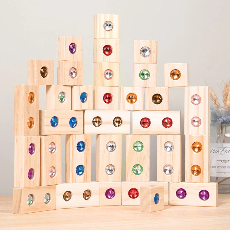 Rectangular wooden gem blocks stacked into a tall wall on a wooden surface