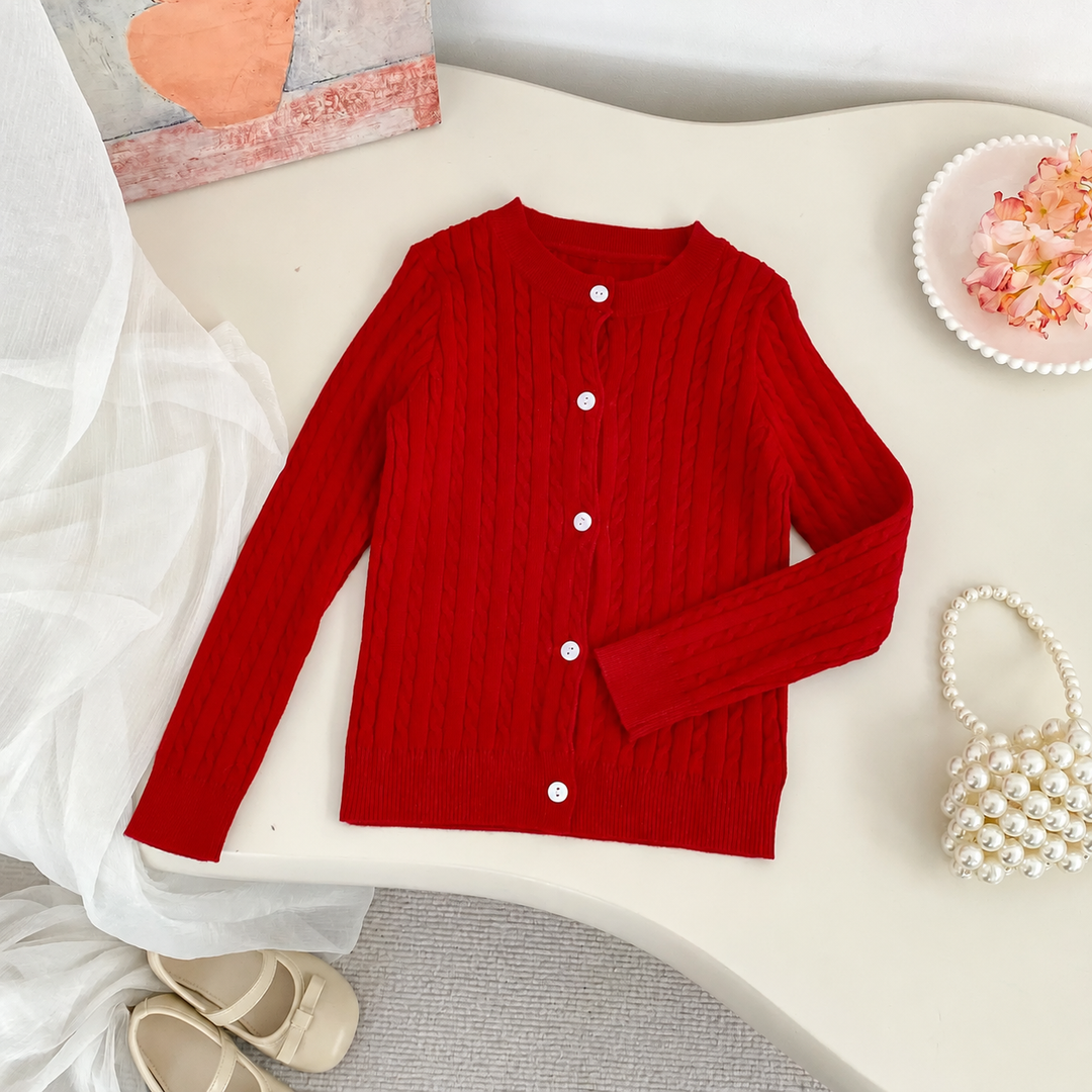 Red cable-knit cardigan with a round neckline and long sleeves