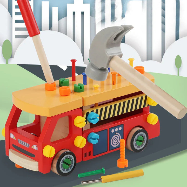 Red wooden construction truck with a toy hammer and screwdriver above its fastener-filled roof