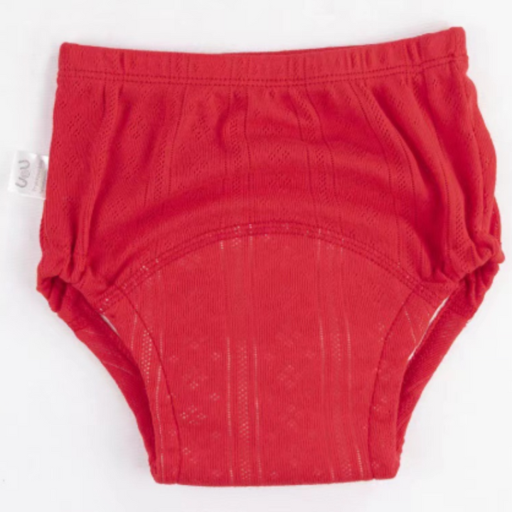 Red cotton training pants with a curved absorbent panel and gathered leg openings.