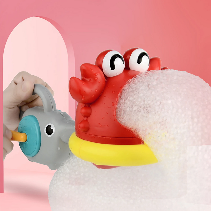 Red crab bath toy making a thick stream of foam with the attached hand-crank blower